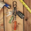 1 moschettone a doppia camera e 4 agganciati a cinghia multi-anello nero